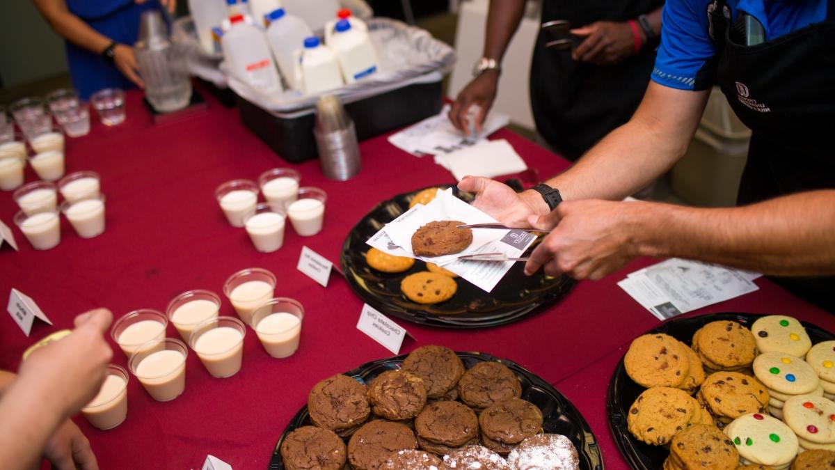 Cookies and milk are served to Trinity students at Student Involvement event.